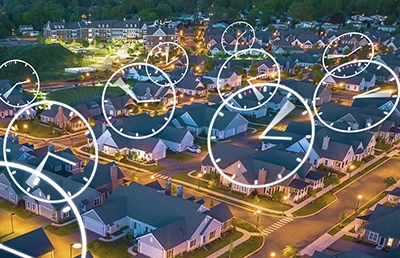 Clocks over 3D renderings of houses